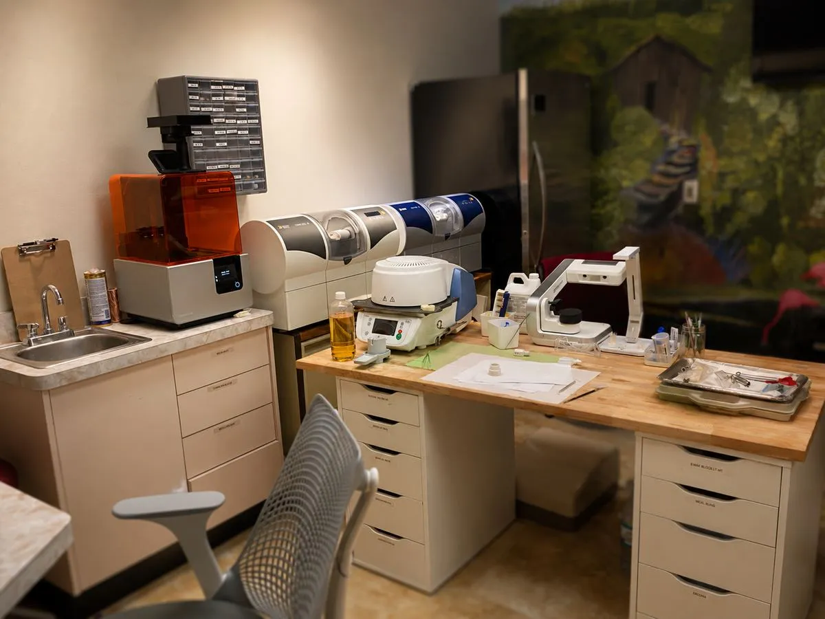 In-house CEREC MC XL milling unit, sintering oven, and 3D printer for same-day crown fabrication